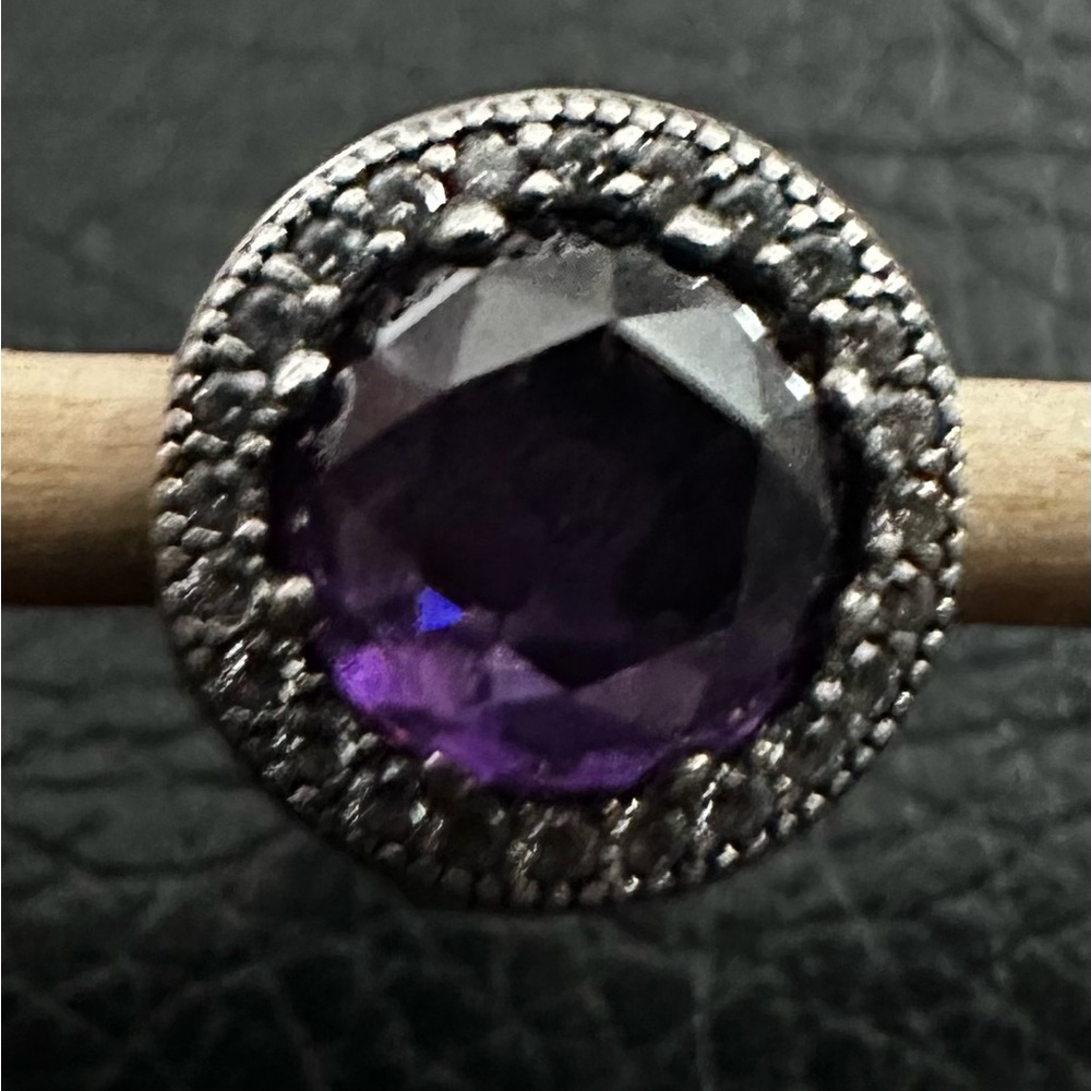Authentic Pandora “Royal Purple Radiant Hearts” retired charm.
